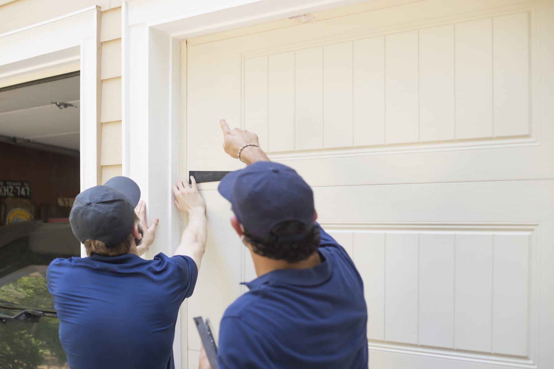 two men doing a pest inspection on a home